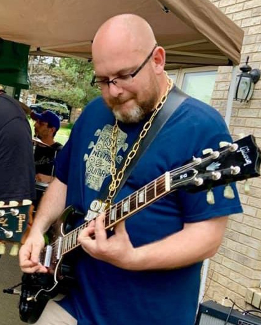 Jason Ziolo with a guitar